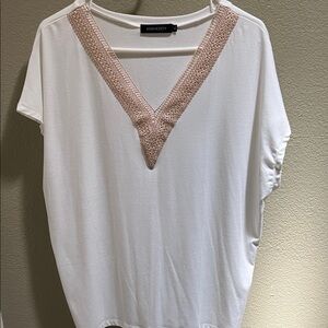Off white V neck top with beige neckline